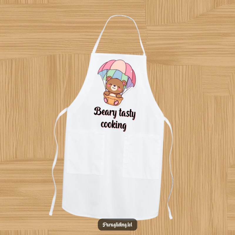 Funny apron with a happy bear floating peacefully in a colorful parachute, perfect for relaxed cooking and kitchen serenity, great funny gift.