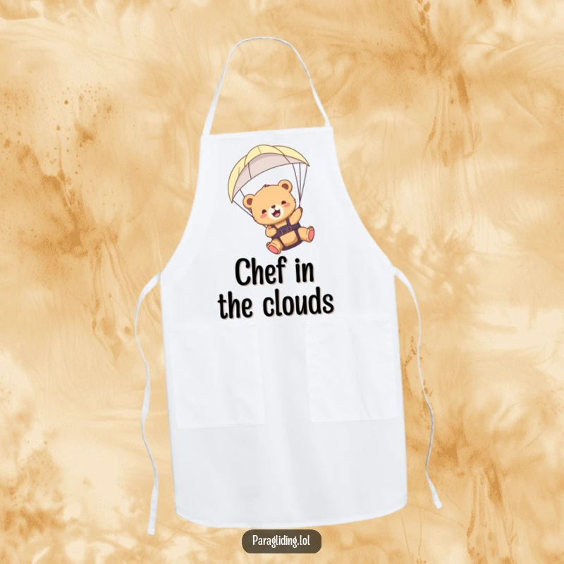 Funny bear cub paraglider apron depicting a cub joyfully paragliding, a humorous and practical kitchen accessory.