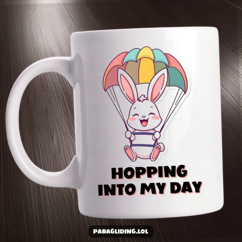 Funny mug featuring a happy bunny paragliding under a colorful canopy, perfect for cheerful mornings.