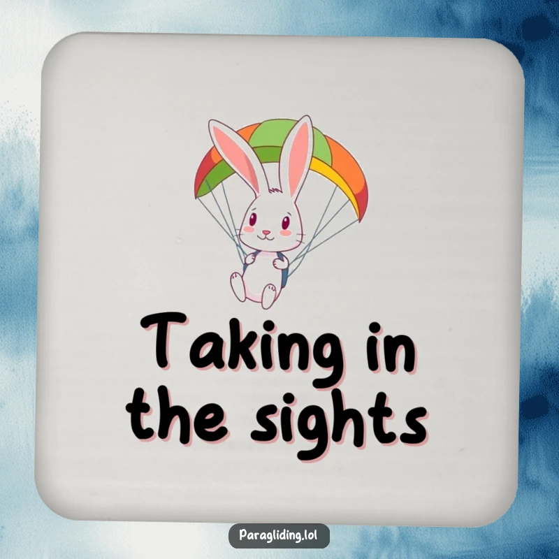 Funny curious rabbit looks down from a colorful paraglider on a drink coaster, bringing airborne curiosity to beverage protection.
