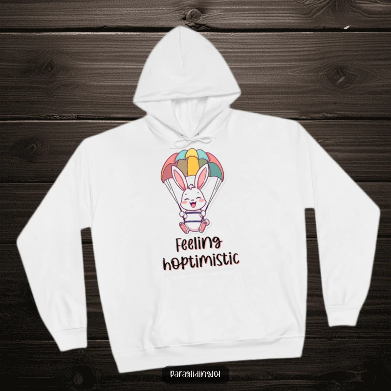 Cozy funny hoodie with a cheerful bunny paragliding, offering warmth and whimsical adventure vibes.