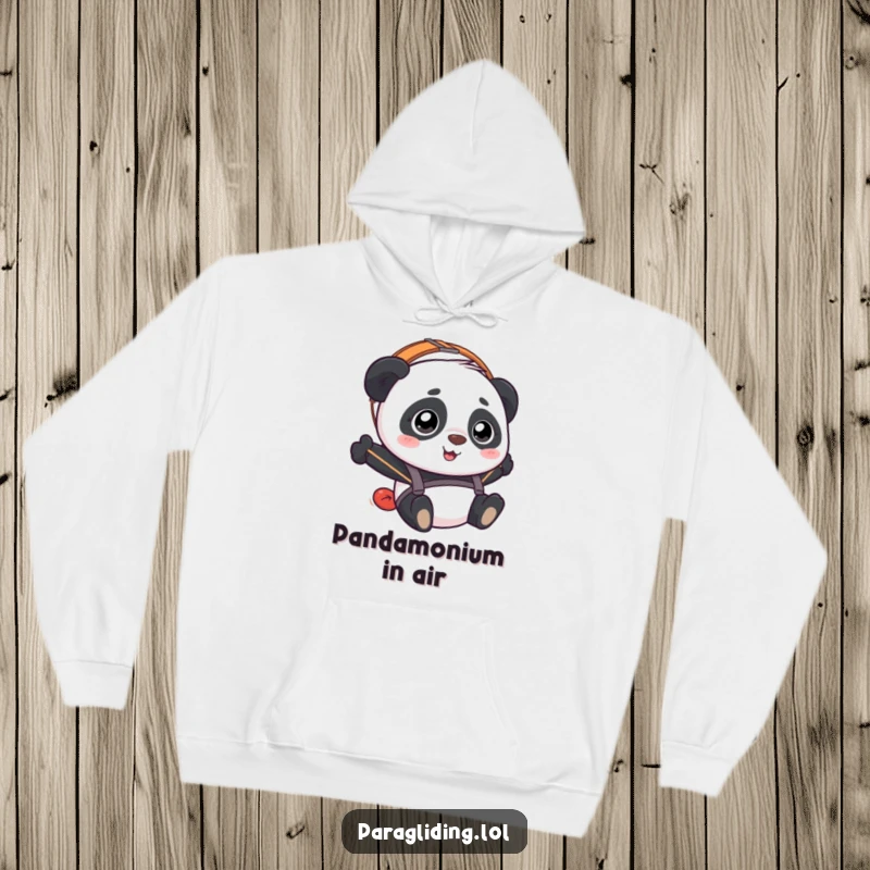 Funny Panda Paraglider Hoodie depicting a panda with a bewildered but happy expression during a paragliding flight.