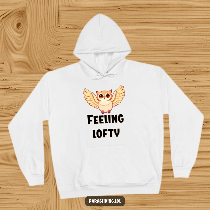 Funny happy owl, wings spread wide in flight, on a cozy hoodie, perfect funny gift.