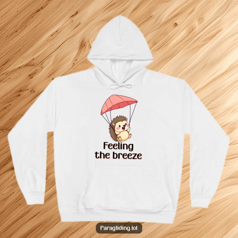 Funny Hedgehog Hoodie: A cozy hoodie featuring a cheerful hedgehog paragliding, embracing the wind with pure delight.
