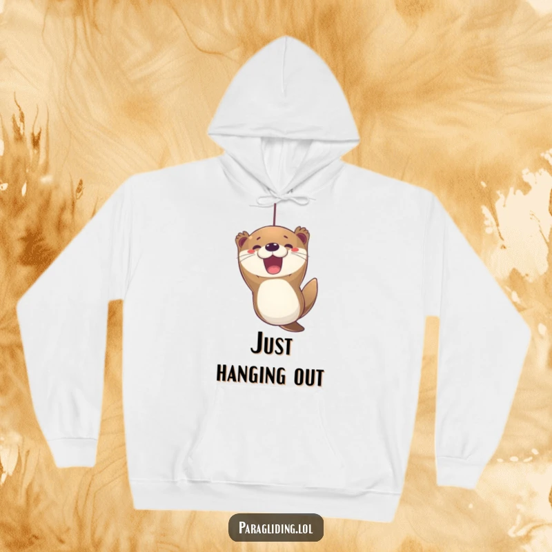 Funny otter paragliding hoodie, featuring an excited otter with a joyful expression, suspended in the air, creating cozy fun.