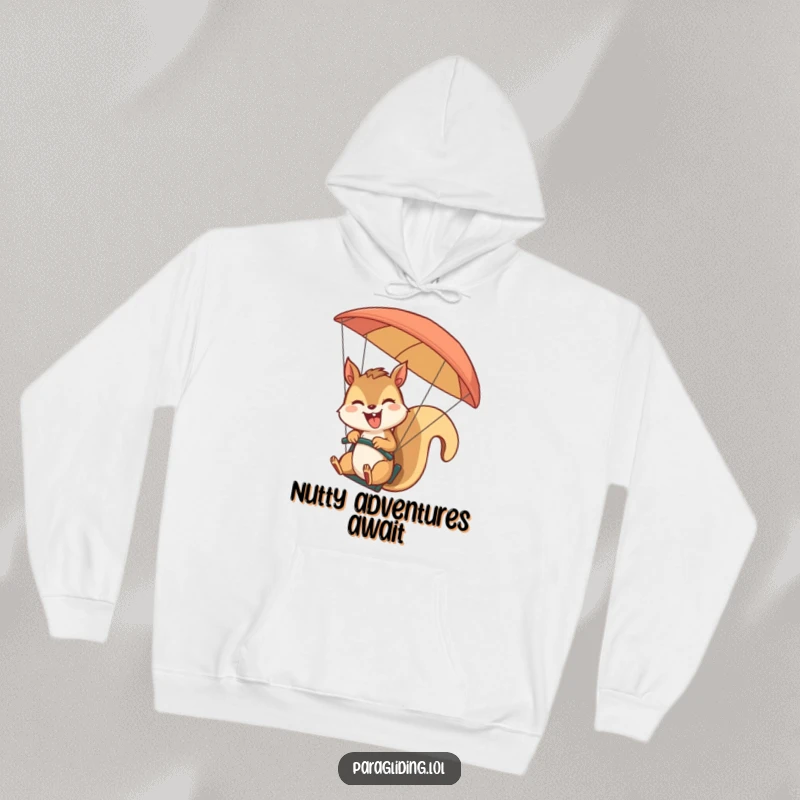 Funny giggling squirrel paragliding and waving on a cozy hoodie. A warm and humorous funny gift for adventurers.