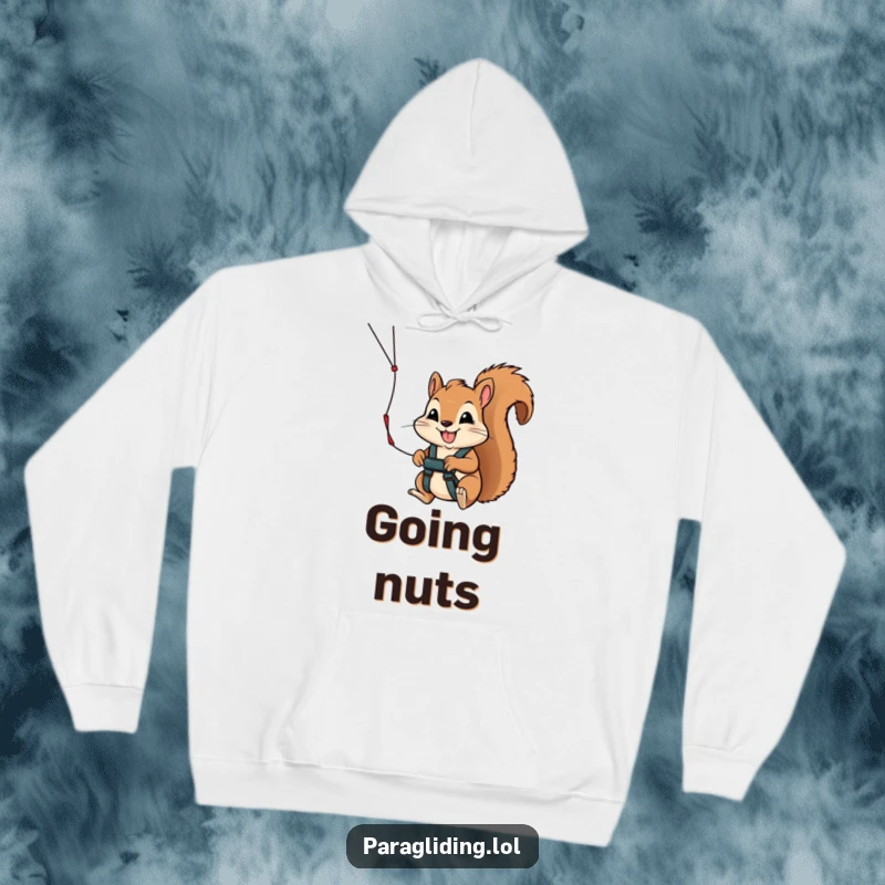 Funny hoodie depicting a brave squirrel clutching a paraglider handle with a determined smile, ready for an exhilarating skydiving adventure.