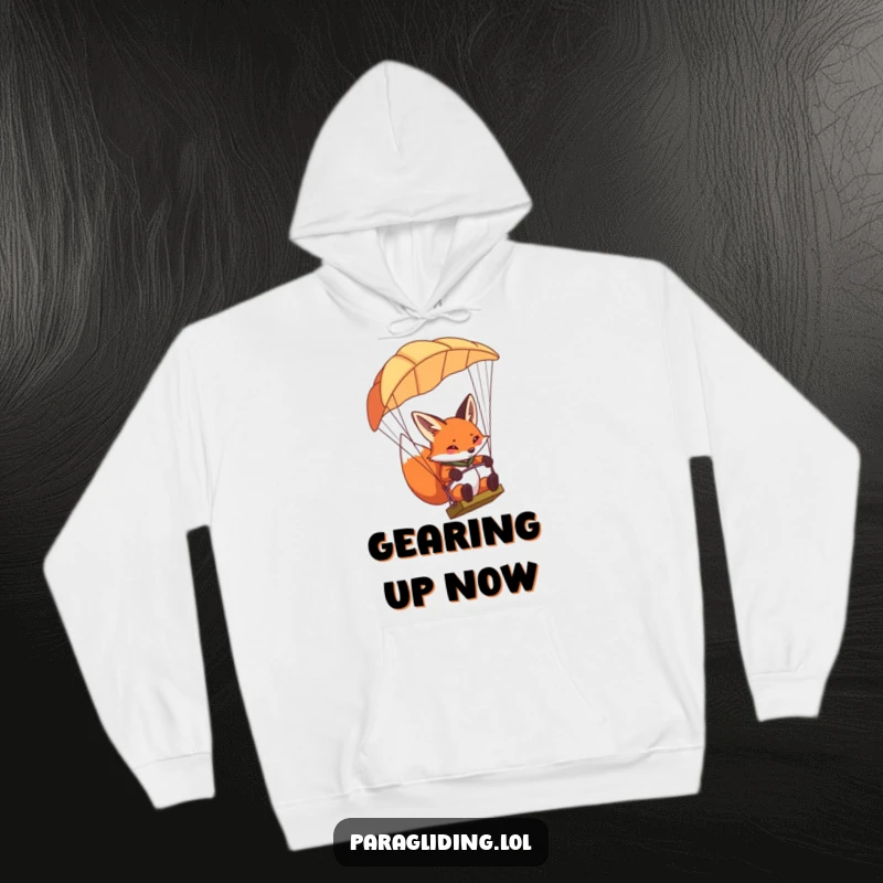 Funny determined fox hoodie, featuring a fox concentrating intently while steering a paraglider, offering cozy focus.