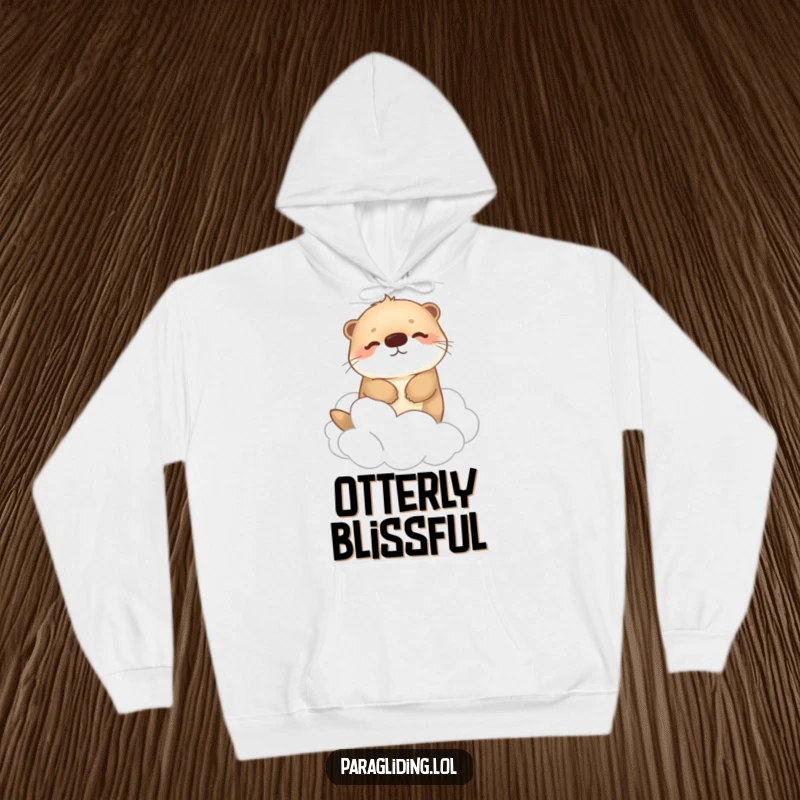 Funny hoodie with a happy, fluffy otter drifting peacefully among fluffy clouds, designed for ultimate comfort and serene relaxation.