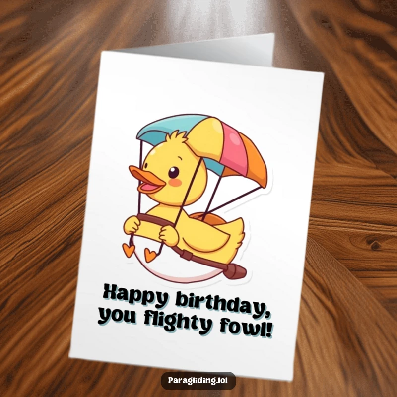 Funny Free Printable Birthday Card: Cheerful duck soaring in a colorful paraglider, enjoying the scenic view.
