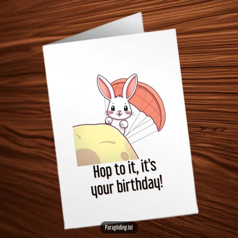 Funny Free Printable Happy Birthday card: A curious rabbit peeking over the edge of a paraglider with wide eyes.
