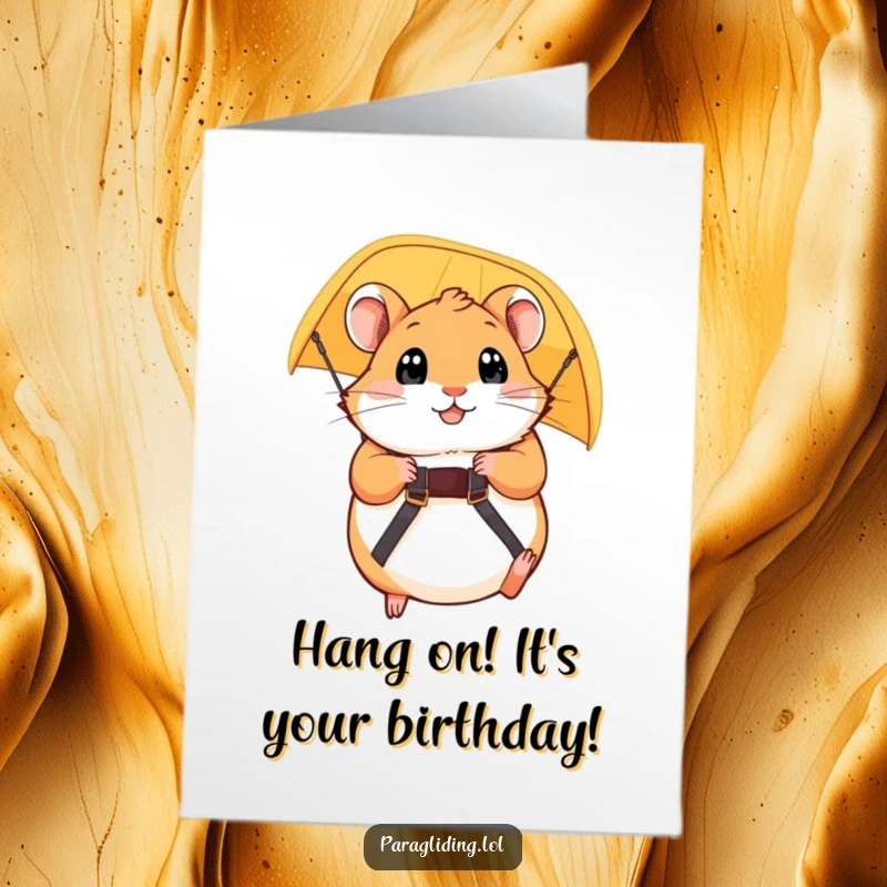 Funny Free Printable Birthday Card: Plump hamster gripping paraglider strap, eyes wide, a thrillingly humorous DIY greeting.