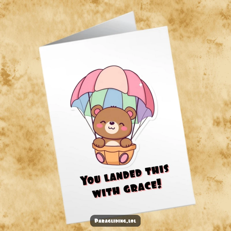 Funny Free Printable Congratulations Card showing a happy bear floating serenely in a vibrant parachute, celebrating achievement.