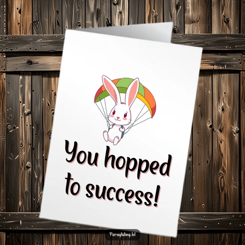 Funny Free Printable Congratulations Card featuring a curious rabbit looking down from a brightly colored paraglider.