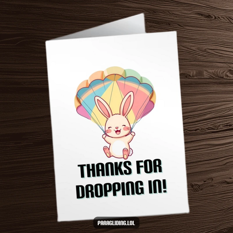 Free Printable Thank You Card: A cheerful bunny dangles from a colorful parachute, conveying heartfelt thanks.