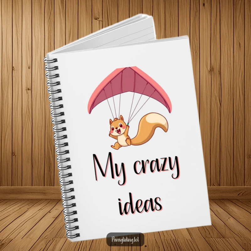 Funny squirrel paraglider notebook featuring an excited squirrel dangling, ideal for capturing adventurous thoughts.