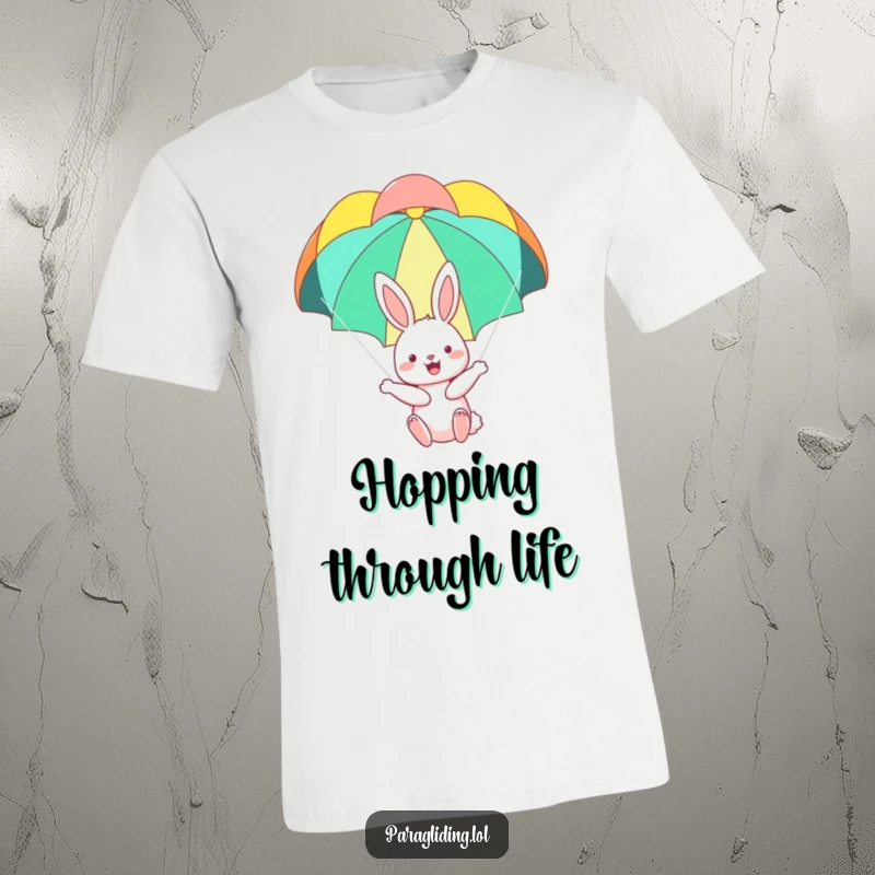 Funny t-shirt with a happy bunny floating serenely under a colorful parachute, capturing a moment of pure delight and playful freedom.