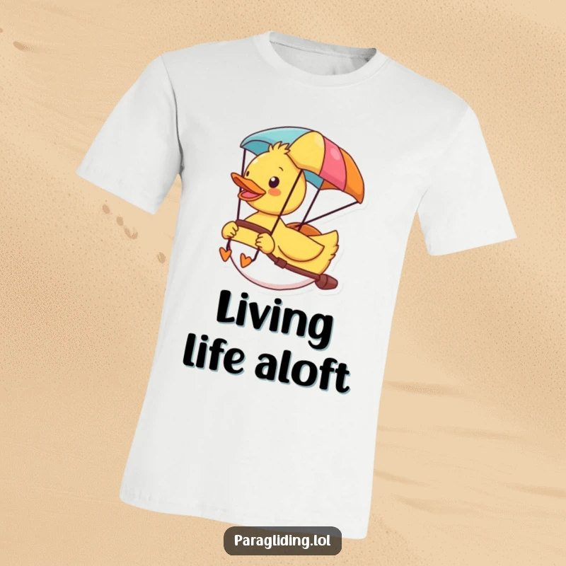 Funny t-shirt depicting a cheerful duck having a blast paragliding, enjoying the colorful scenery from above.