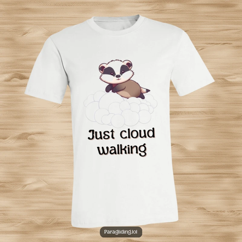 Funny t-shirt showing a graceful badger smoothly gliding over fluffy clouds with a calm, composed, and subtly humorous demeanor.