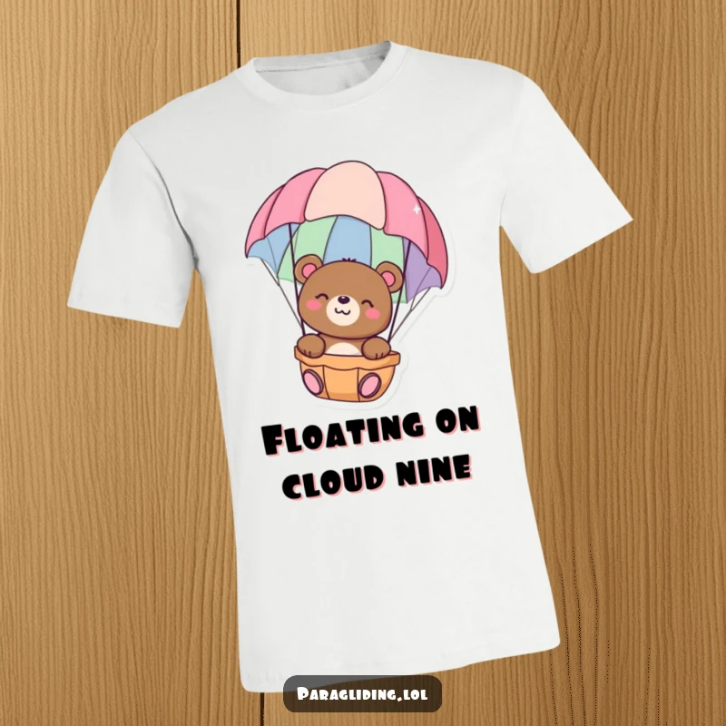 Funny t-shirt featuring a happy bear floating peacefully in a colorful parachute, symbolizing relaxation and gentle adventure, an excellent funny gift.