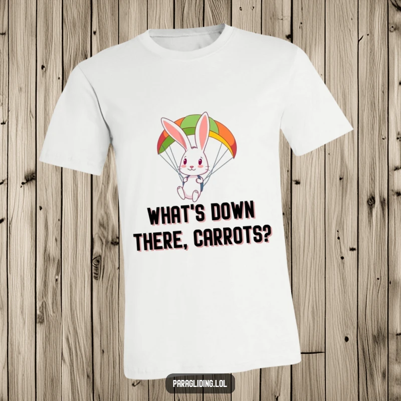 Funny curious rabbit looks down from a colorful paraglider, a t-shirt for those who love to explore from above.