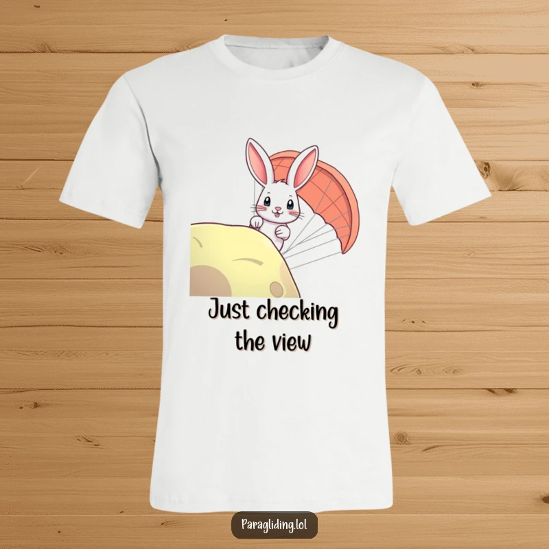 Funny rabbit paragliding t-shirt featuring a bunny curiously peeking over the edge, a humorous take on adventure.