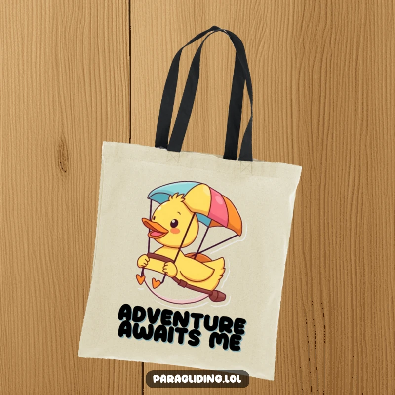 Funny tote bag with a cheerful duck enjoying the vista from its colorful paraglider, a symbol of fun travel.