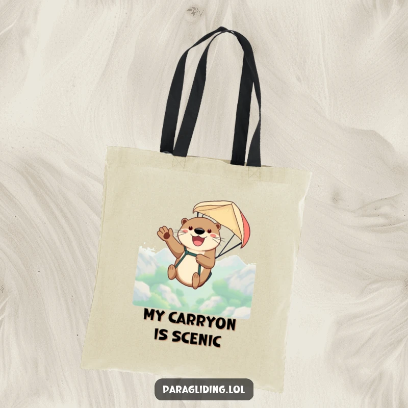 Funny tote bag depicting a happy otter waving joyfully from a paraglider, high above, perfect for carrying daily items with flair.